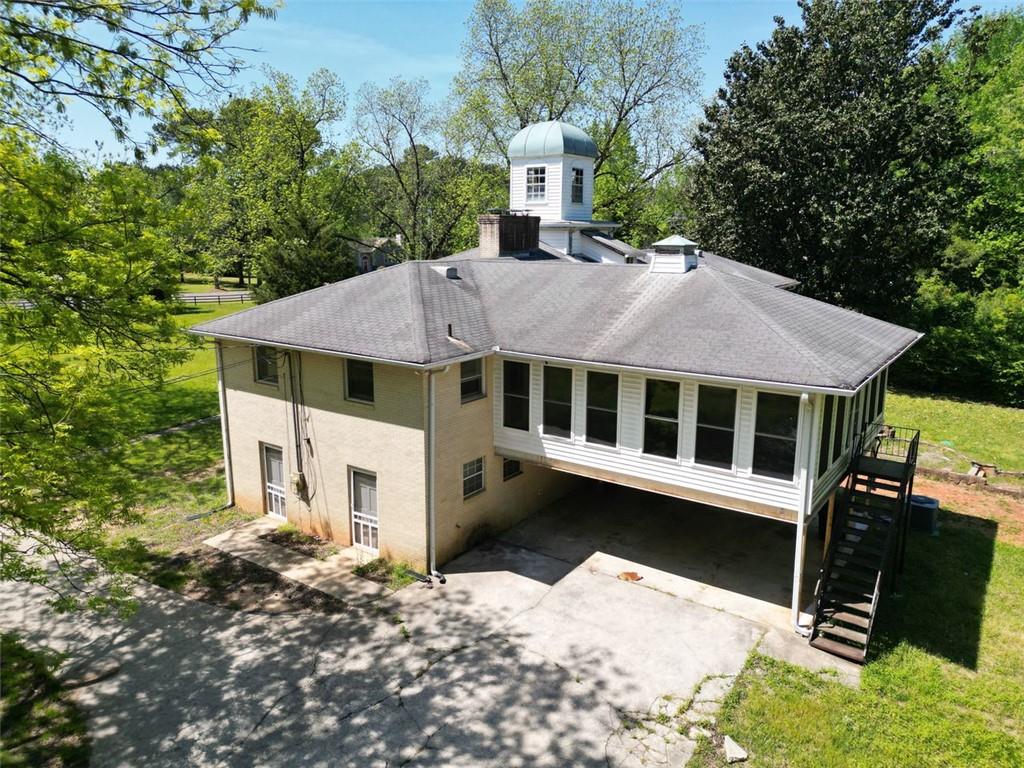 11433 Panhandle Road Hampton, GA 30228 - Photo 18 of 22 a aerial view of a house with a yard