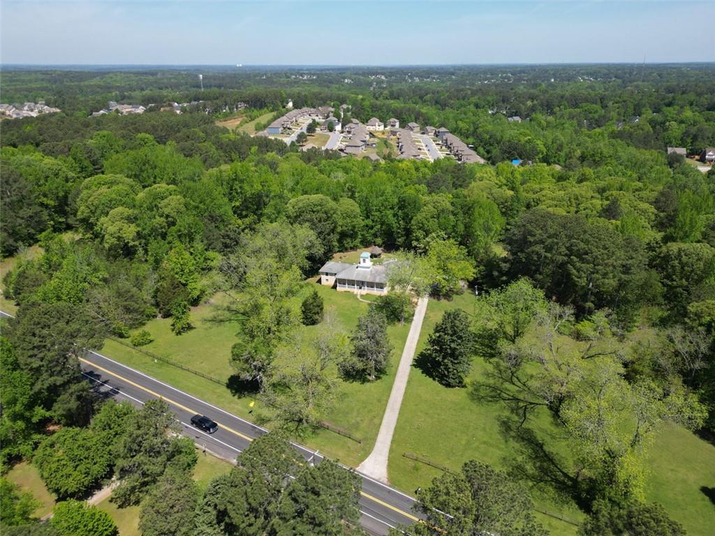 11433 Panhandle Road Hampton, GA 30228 - Photo 2 of 22 an aerial view of a residential houses with outdoor space and trees