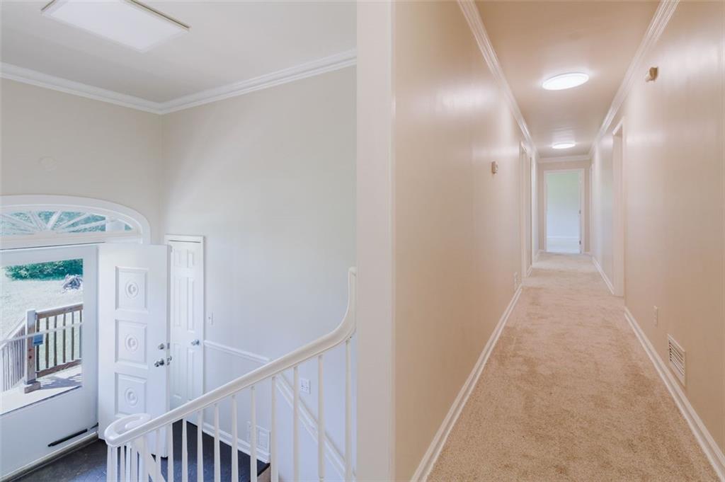 11433 Panhandle Road Hampton, GA 30228 - Photo 5 of 22 a view of a hallway with a white walls