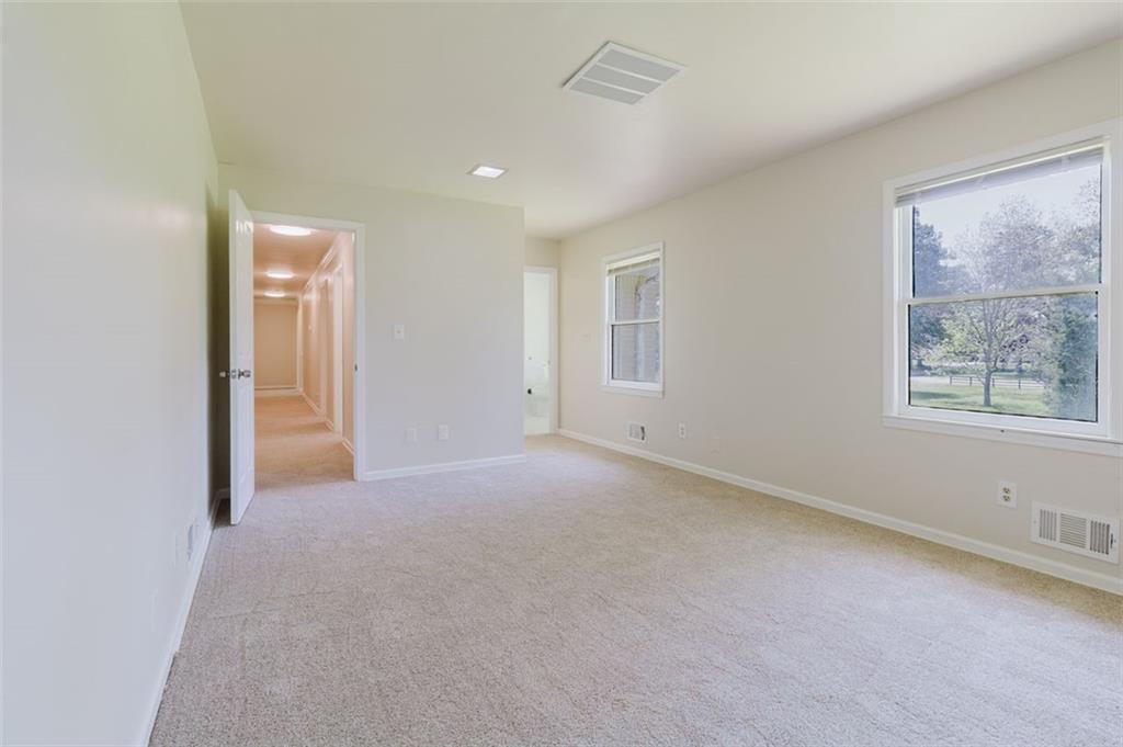 11433 Panhandle Road Hampton, GA 30228 - Photo 10 of 22 an empty room with windows and closet