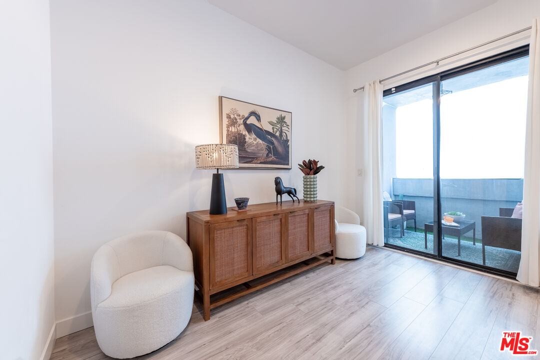 839 Larrabee Street, Unit 6 West Hollywood, CA 90069 - Photo 12 of 34 a living room with furniture and a large window