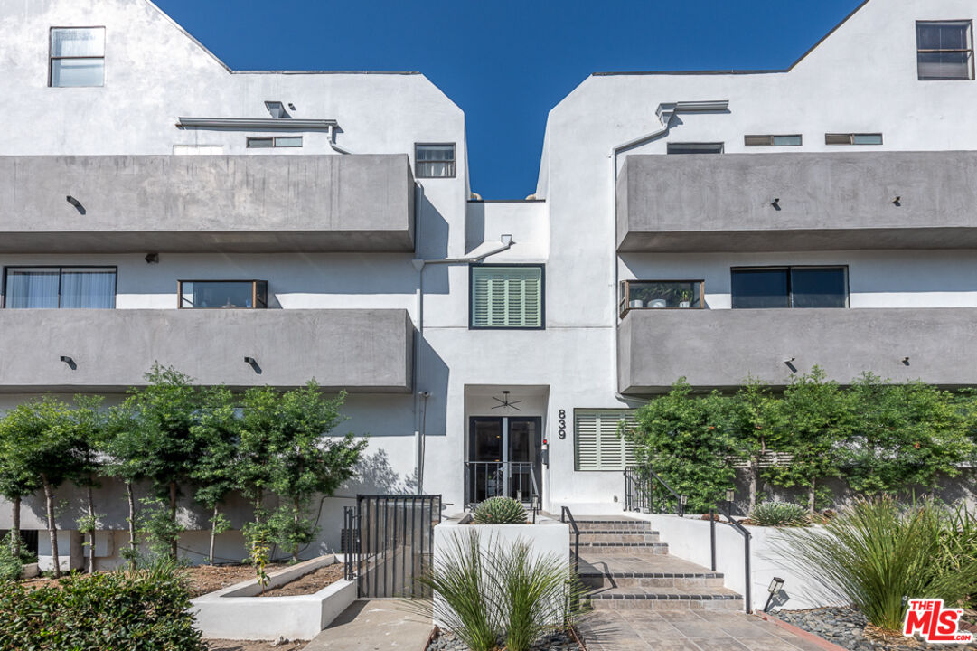 839 Larrabee Street, Unit 6 West Hollywood, CA 90069 - Photo 2 of 34 a aerial view of a house with outdoor space and a fountain