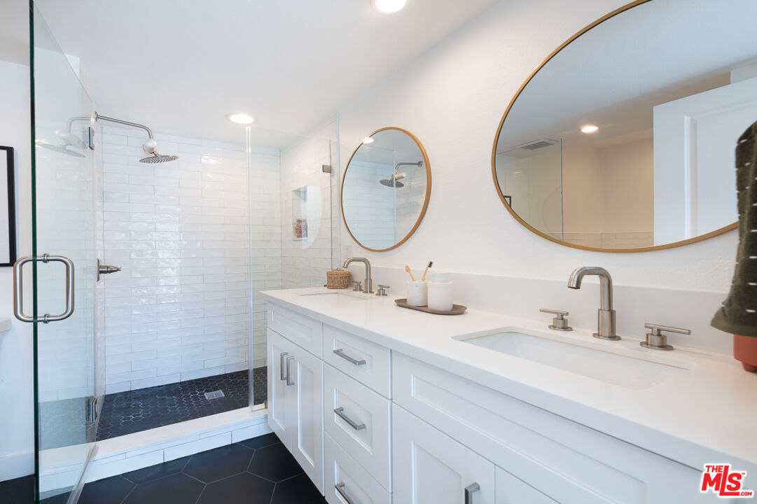 839 Larrabee Street, Unit 6 West Hollywood, CA 90069 - Photo 27 of 34 a bathroom with a double vanity sink mirror and shower