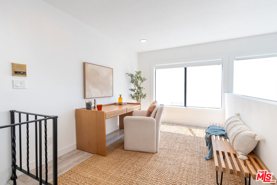 839 Larrabee Street, Unit 6 West Hollywood, CA 90069 - Photo 28 of 34 a living room with furniture and a window
