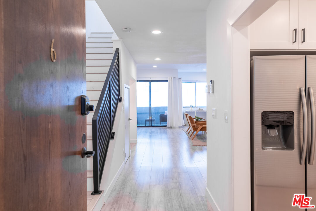 839 Larrabee Street, Unit 6 West Hollywood, CA 90069 - Photo 5 of 34 a view of a hallway view with wooden floor and staircase