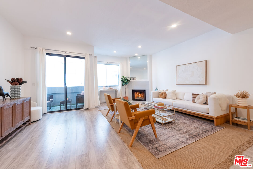 839 Larrabee Street, Unit 6 West Hollywood, CA 90069 - Photo 9 of 34 a living room with furniture or couch and a wooden floor