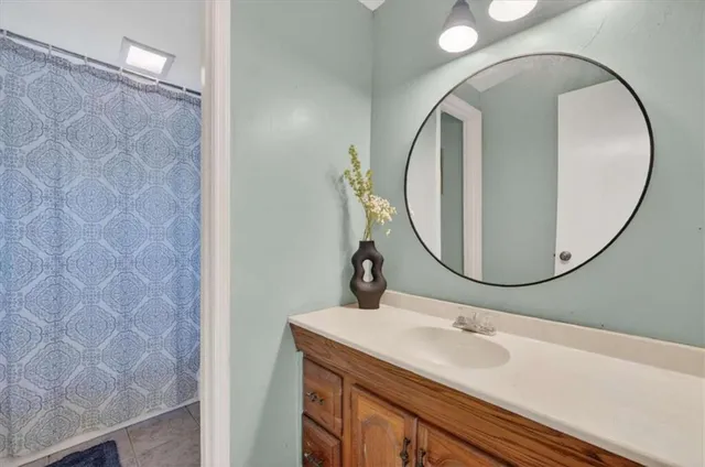 a bathroom with a sink and a mirror