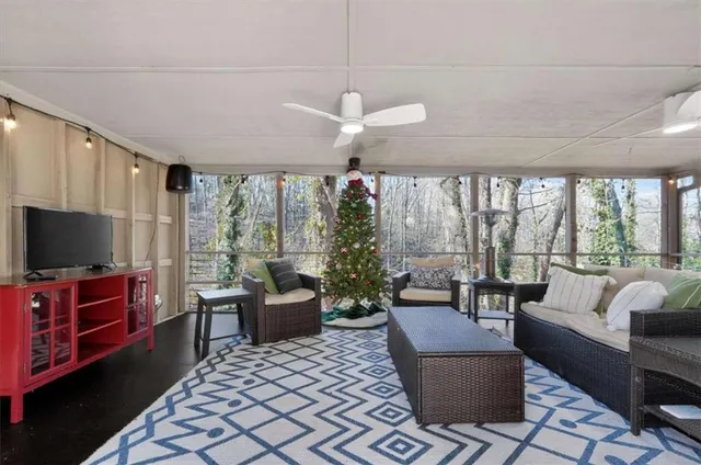 a living room with furniture and a flat screen tv