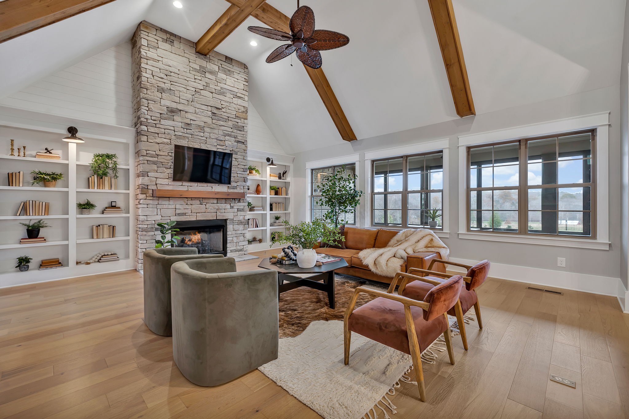 5821 Wagonvale Drive Arrington, TN 37014 - Photo 15 of 69 a living room with furniture a fireplace and a flat screen tv