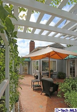 225 West Kenneth Road Glendale, CA 91202 - Photo 12 of 31 a view of a patio with table and chairs under an umbrella