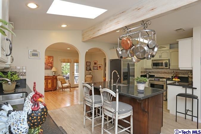 225 West Kenneth Road Glendale, CA 91202 - Photo 14 of 31 a view of a dining room with furniture and chandelier