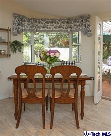 225 West Kenneth Road Glendale, CA 91202 - Photo 18 of 31 a view of a dining room with furniture window and outside view