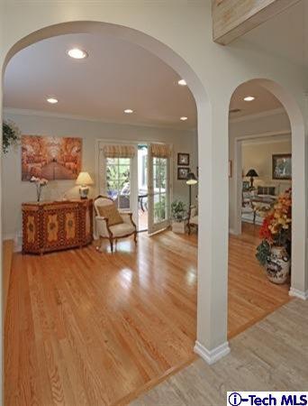 225 West Kenneth Road Glendale, CA 91202 - Photo 19 of 31 a view of a living room and kitchen with furniture and wooden floor