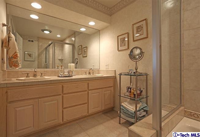 225 West Kenneth Road Glendale, CA 91202 - Photo 23 of 31 a bathroom with a sink a toilet and a mirror