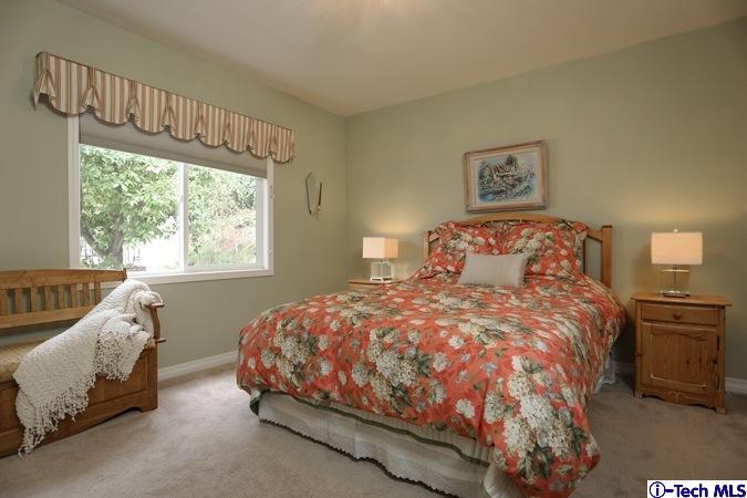 225 West Kenneth Road Glendale, CA 91202 - Photo 27 of 31 a bedroom with a bed and a window