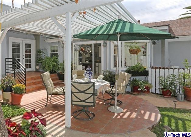 225 West Kenneth Road Glendale, CA 91202 - Photo 30 of 31 a view of a patio with table and chairs potted plants