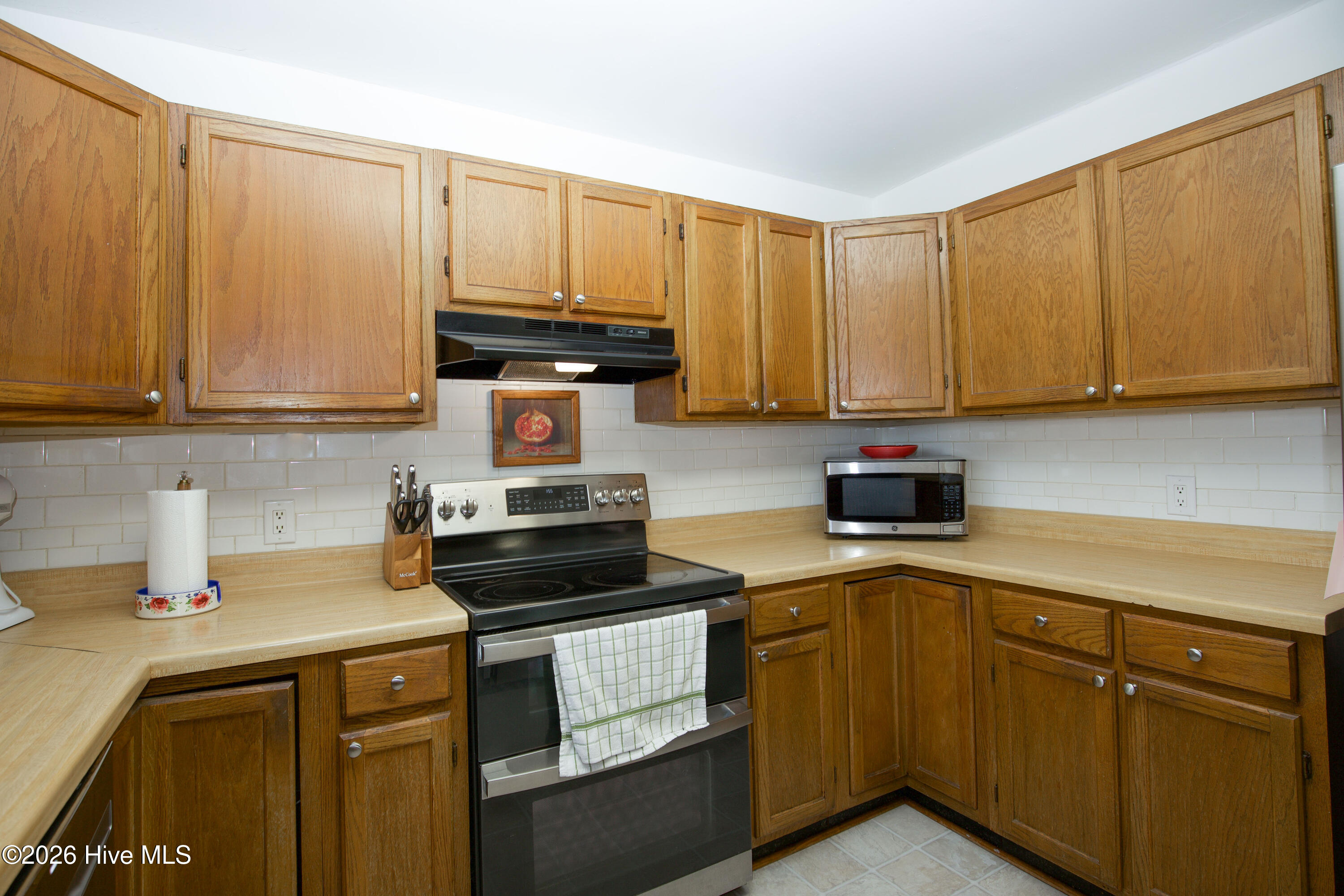 124 Joseph Road Aberdeen, NC 28315 - Photo 12 of 59 Corner view of kitchen showcasing cabinet space, counter layout, and efficient use of space.