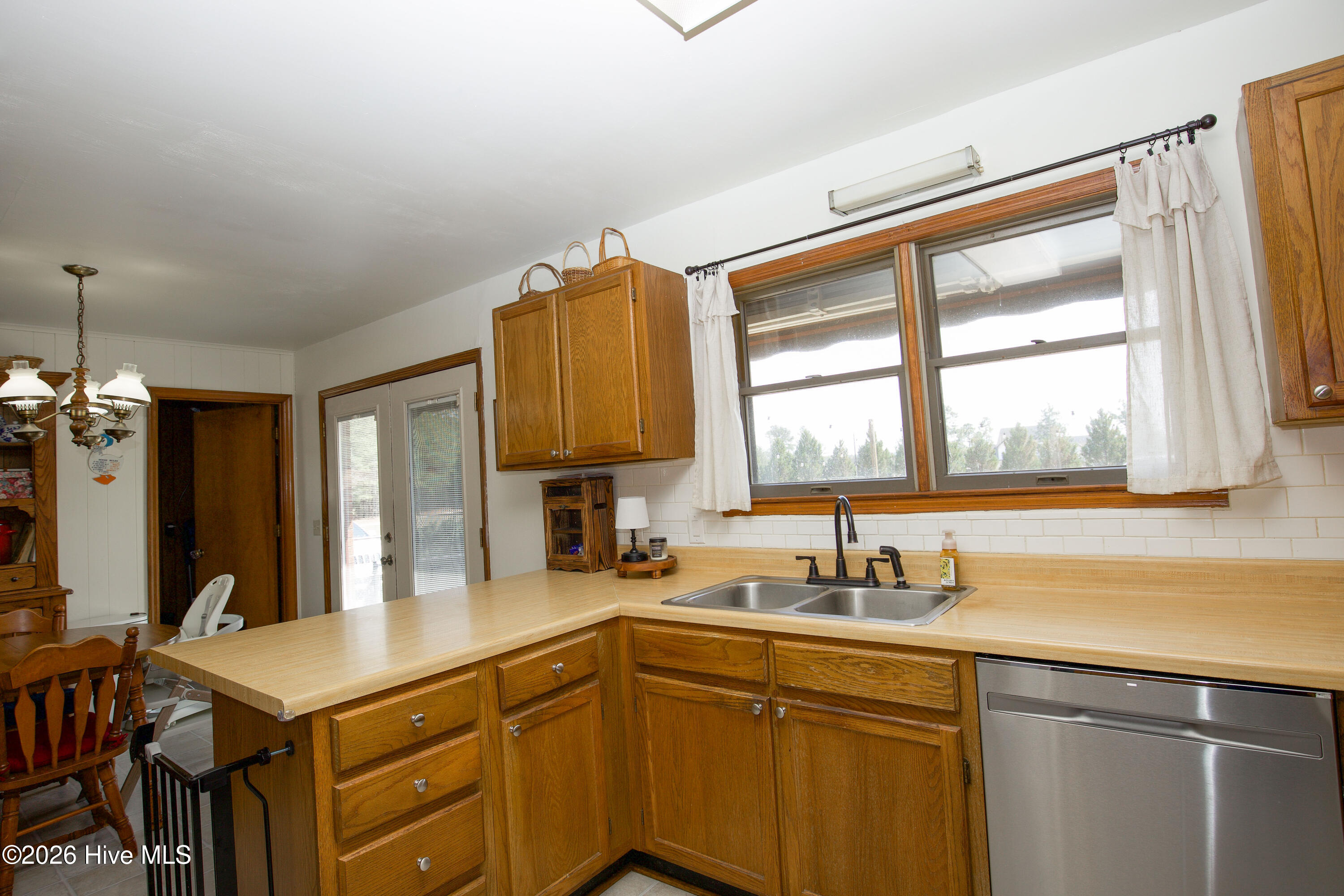 124 Joseph Road Aberdeen, NC 28315 - Photo 15 of 59 Kitchen featuring window over sink with natural light, along with ample counter space and functional layout.