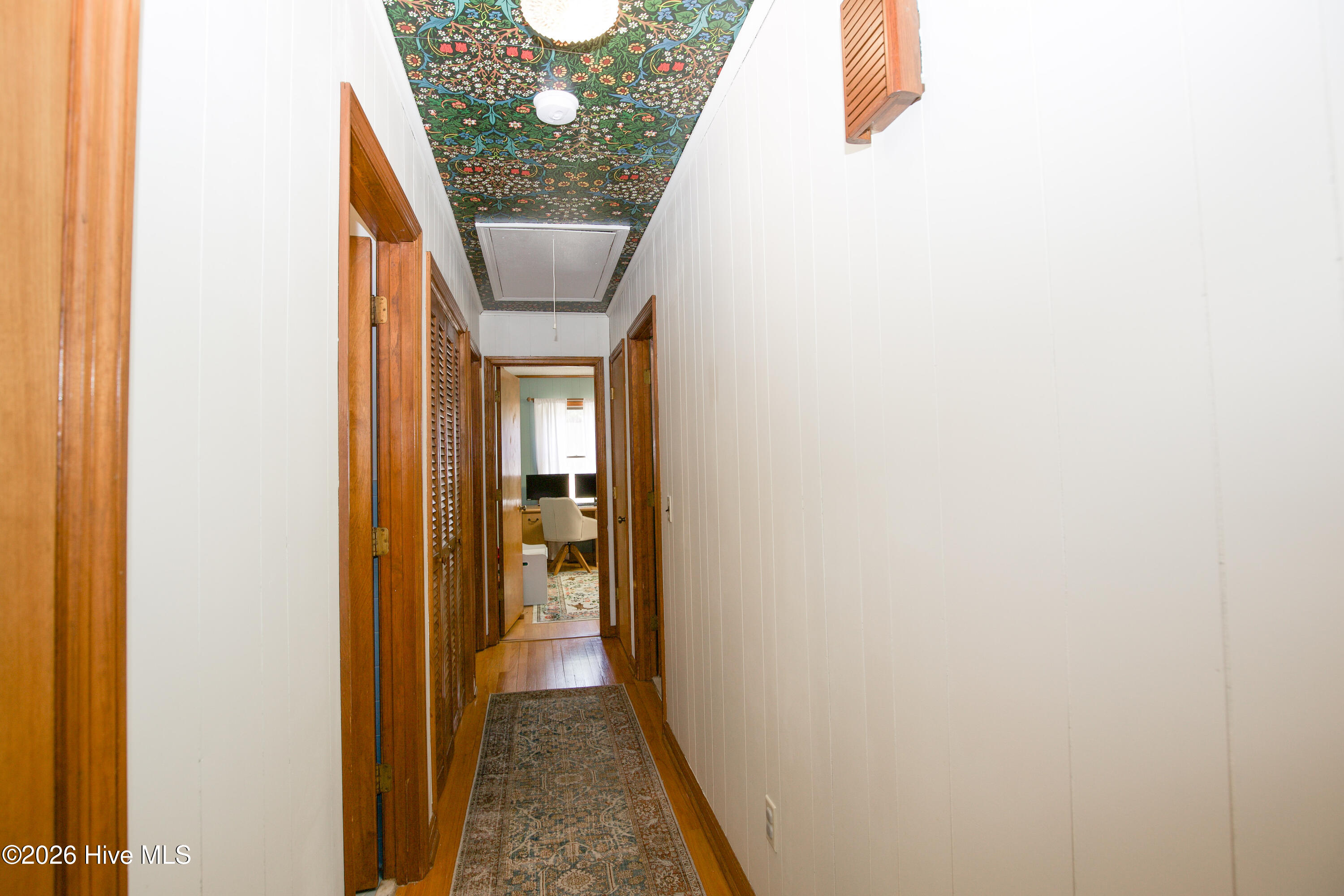 124 Joseph Road Aberdeen, NC 28315 - Photo 18 of 59 Central hallway providing access to bedrooms and bathrooms, creating separation between living and private spaces.
