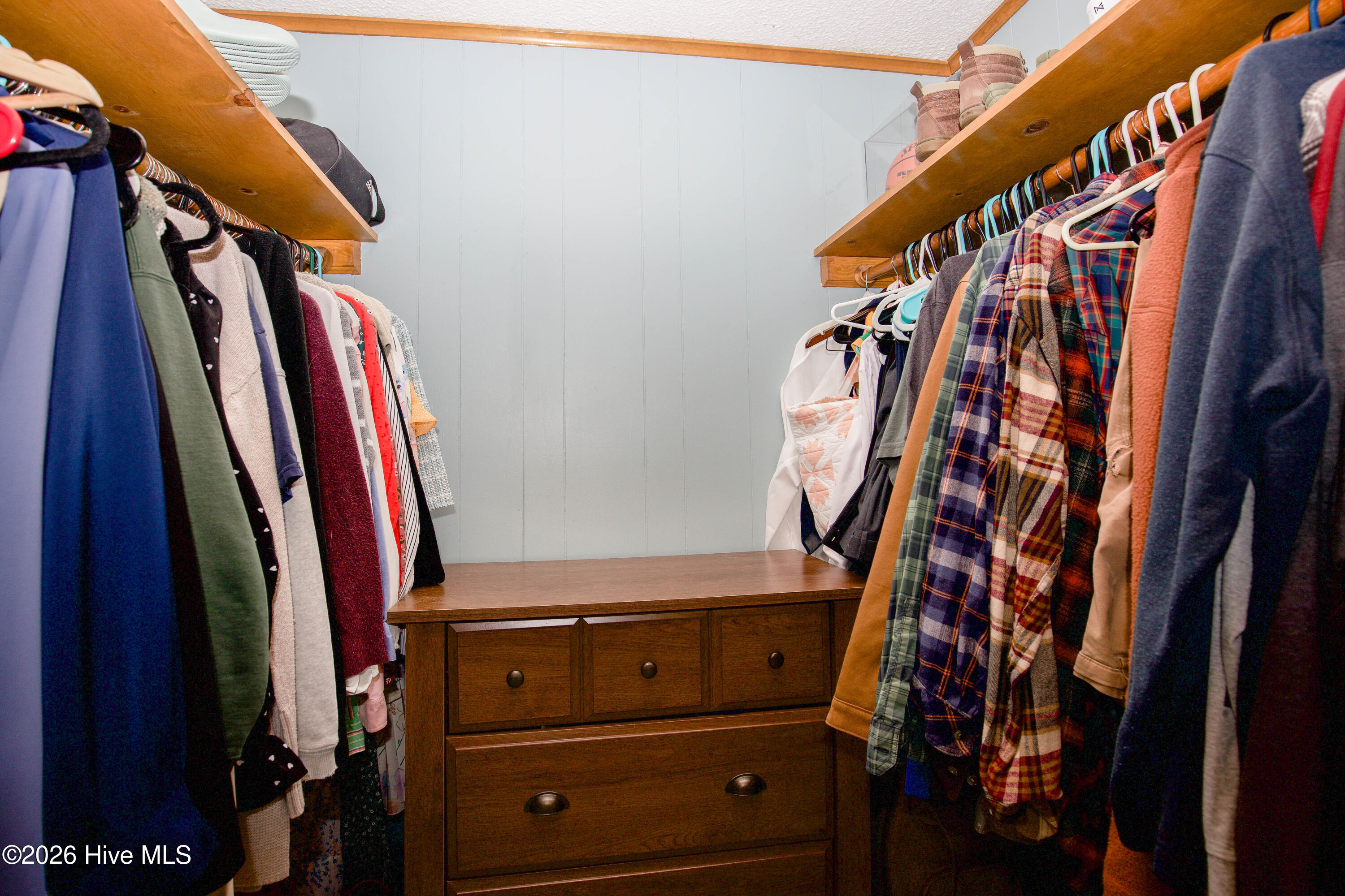 124 Joseph Road Aberdeen, NC 28315 - Photo 22 of 59 Walk-in closet in primary bedroom offering ample storage and organization space.