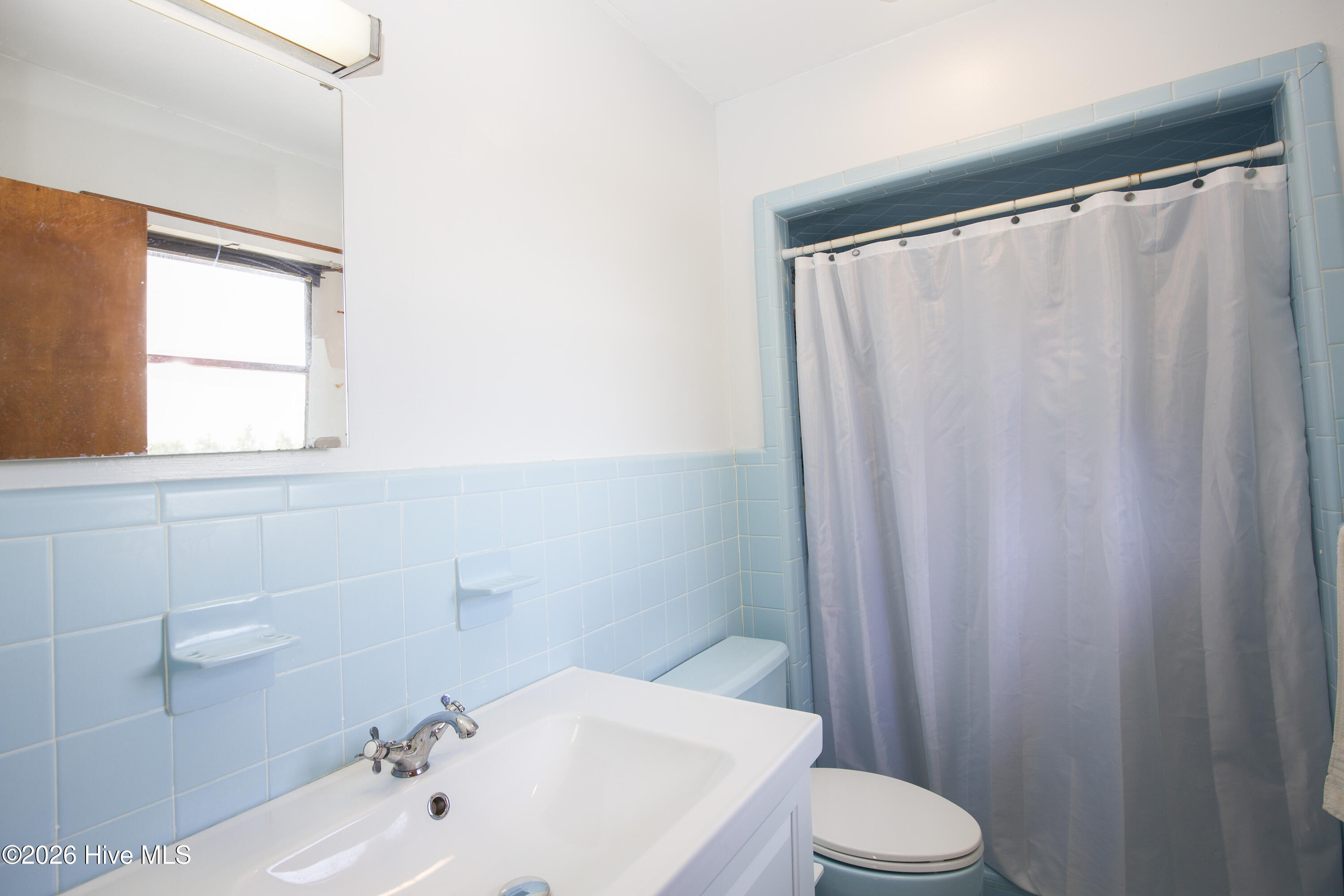 124 Joseph Road Aberdeen, NC 28315 - Photo 23 of 59 Full bathroom featuring clean layout, tub and shower combination, and functional design.