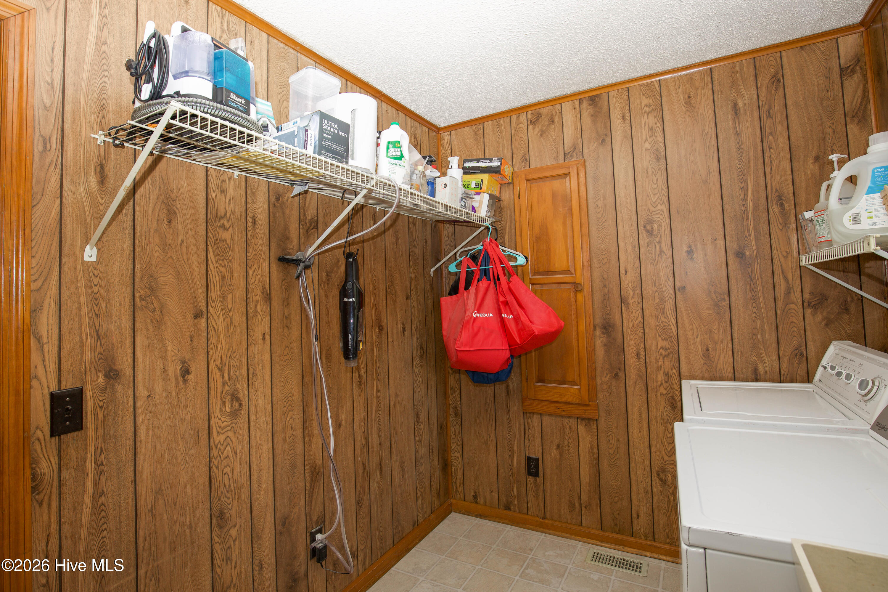 124 Joseph Road Aberdeen, NC 28315 - Photo 33 of 59 Laundry room with built-in storage and dedicated workspace for household needs.