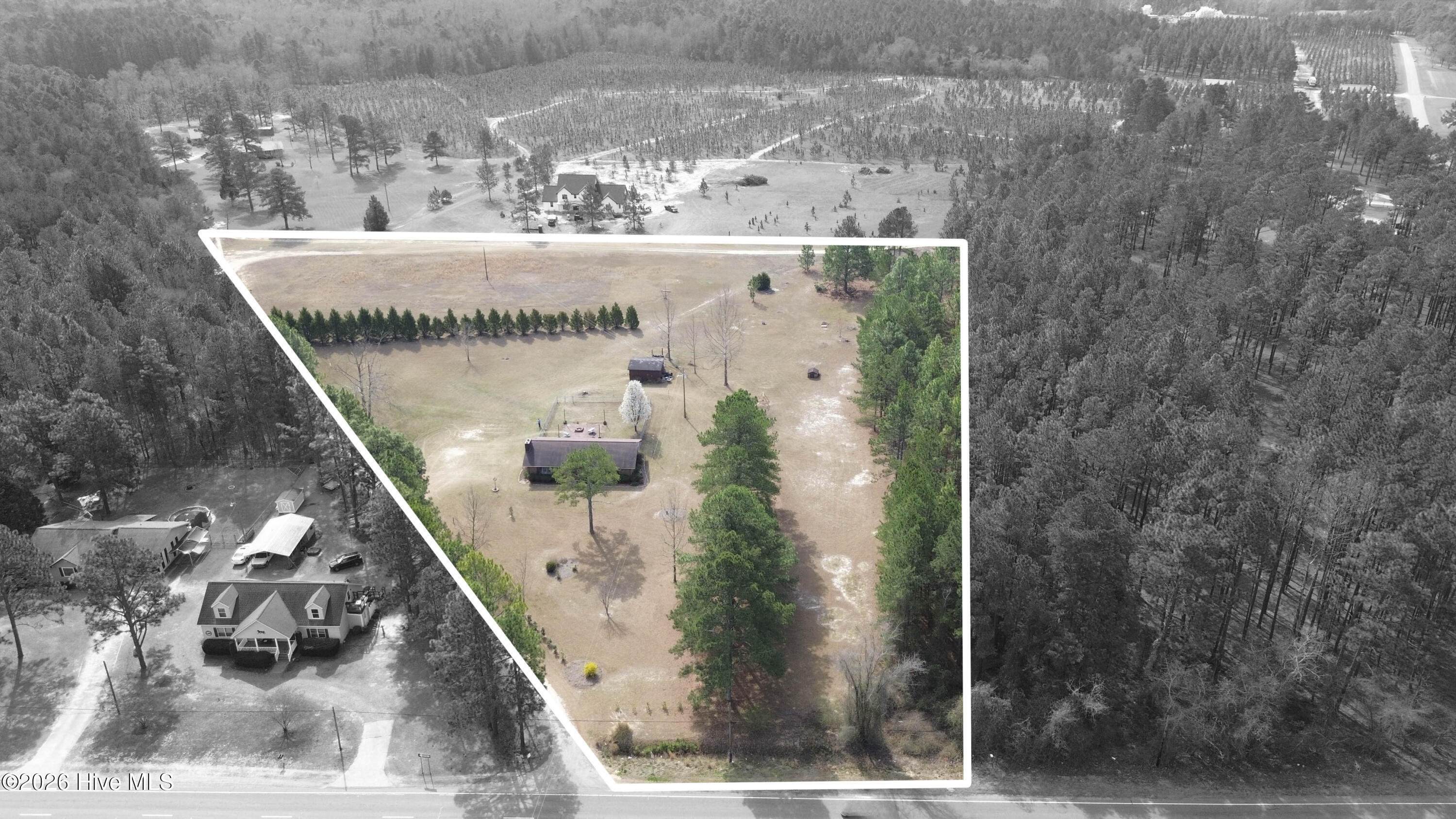 124 Joseph Road Aberdeen, NC 28315 - Photo 3 of 64 Aerial view of 124 Joseph Road showing the home, yard, and surrounding acreage. The property consists of two adjoining parcels totaling approximately 5.06 acres in Moore County. Parcel ID 00055747 (2.18 acres) contains the residence and is being sold together with adjoining Parcel ID 00055745 (2.88 acres). The land features a combination of open space and mature trees with room for gardening, recreation, or additional outbuildings. Boundary lines shown are approximate and for illustration purposes only. Buyers should consult the recorded plat or a licensed survey to verify exact property boundaries.