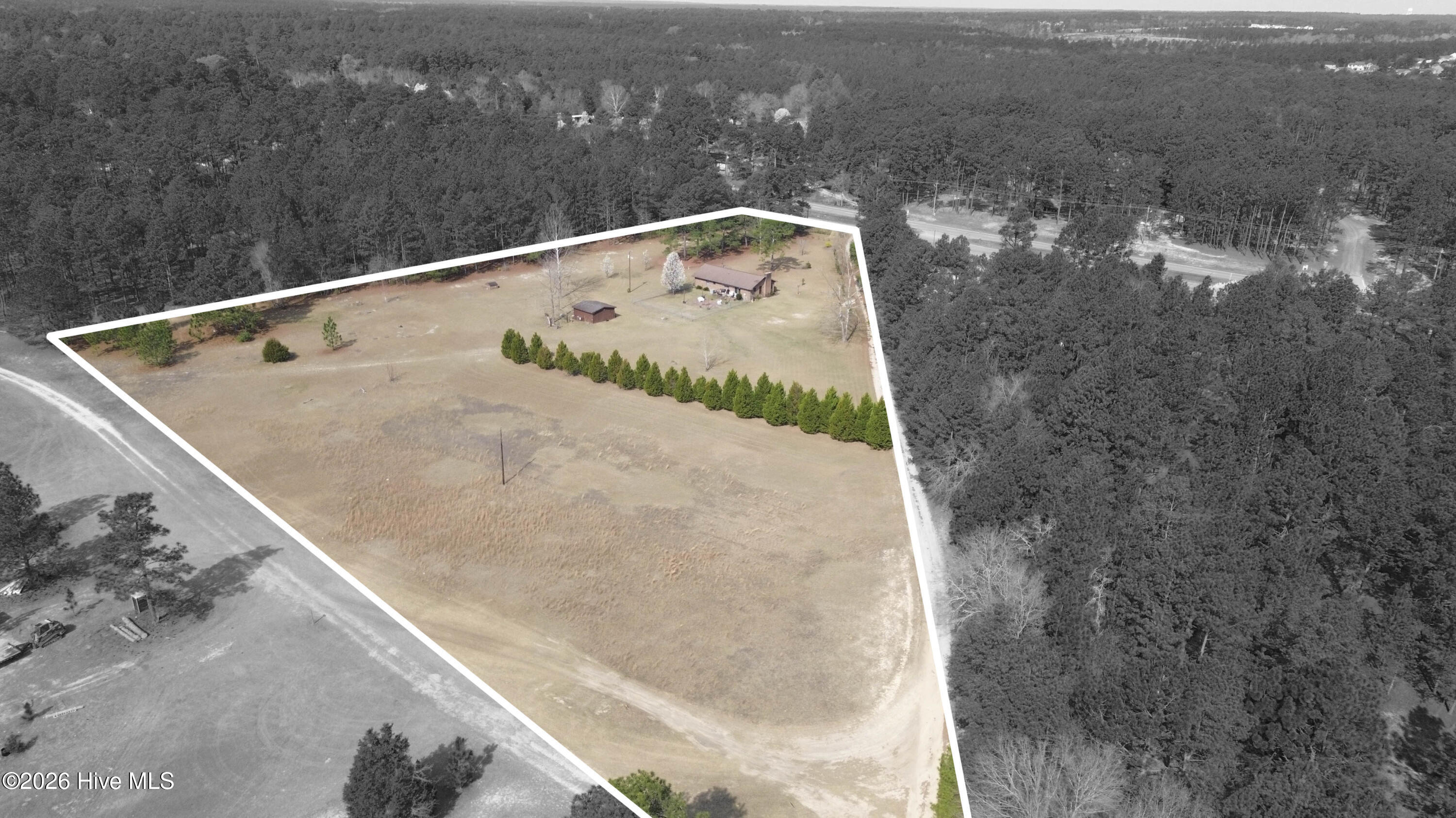 124 Joseph Road Aberdeen, NC 28315 - Photo 58 of 59 Aerial view of 124 Joseph Road oriented toward the southeast corner of the property, showing the home, yard, and surrounding acreage. The property consists of two adjoining parcels totaling approximately 5.06 acres in Moore County. Parcel ID 00055747 (2.18 acres) contains the residence and is being sold together with adjoining Parcel ID 00055745 (2.88 acres). The land features a combination of open space and mature trees, offering room for gardening, recreation, or additional outbuildings. Boundary lines shown are approximate and provided for illustration purposes only. Buyers should consult the recorded plat or a licensed survey to verify exact property boundaries.