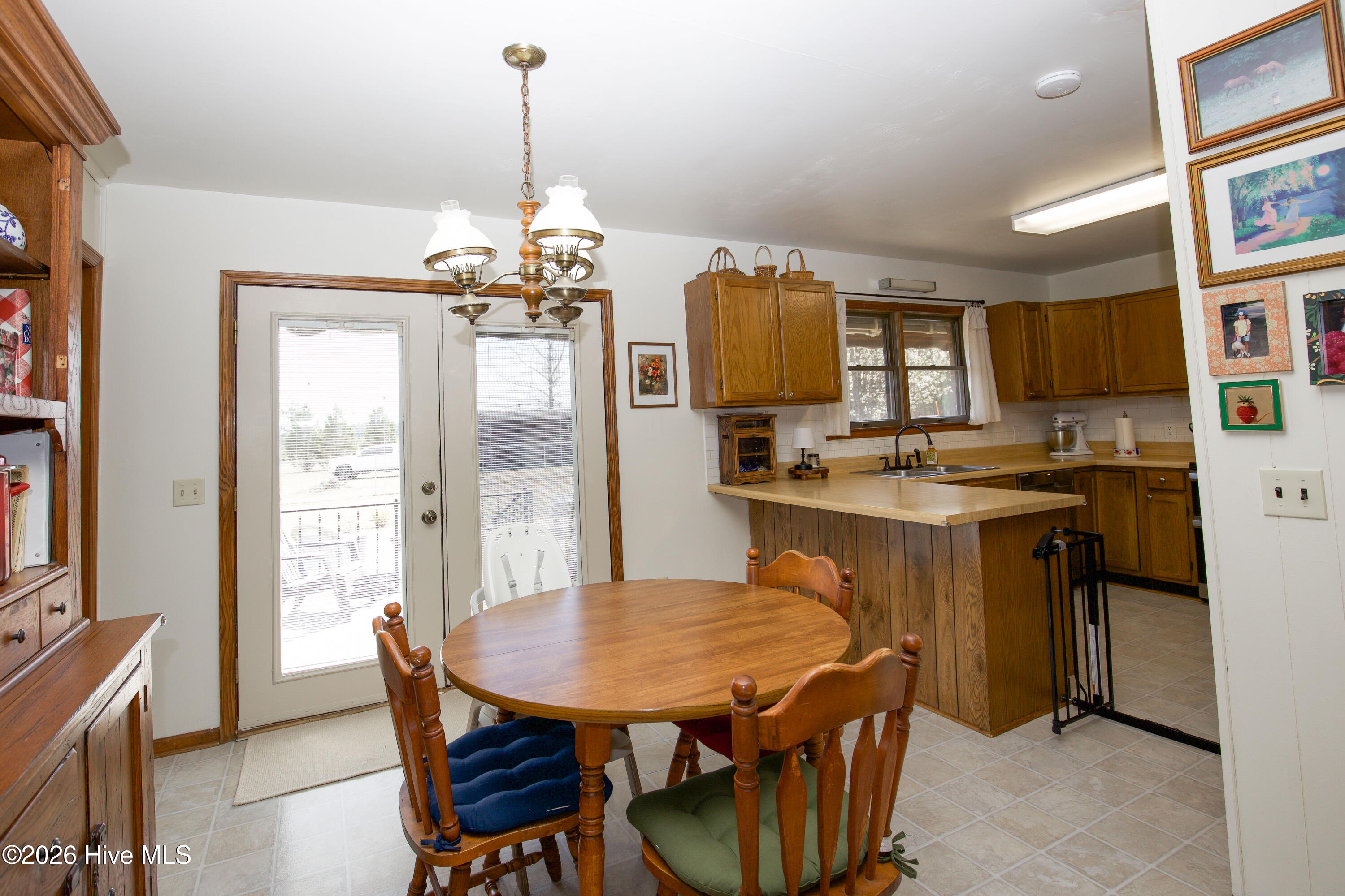 124 Joseph Road Aberdeen, NC 28315 - Photo 9 of 59 Kitchen view from dining area highlighting layout, workspace, and accessibility to surrounding living spaces.