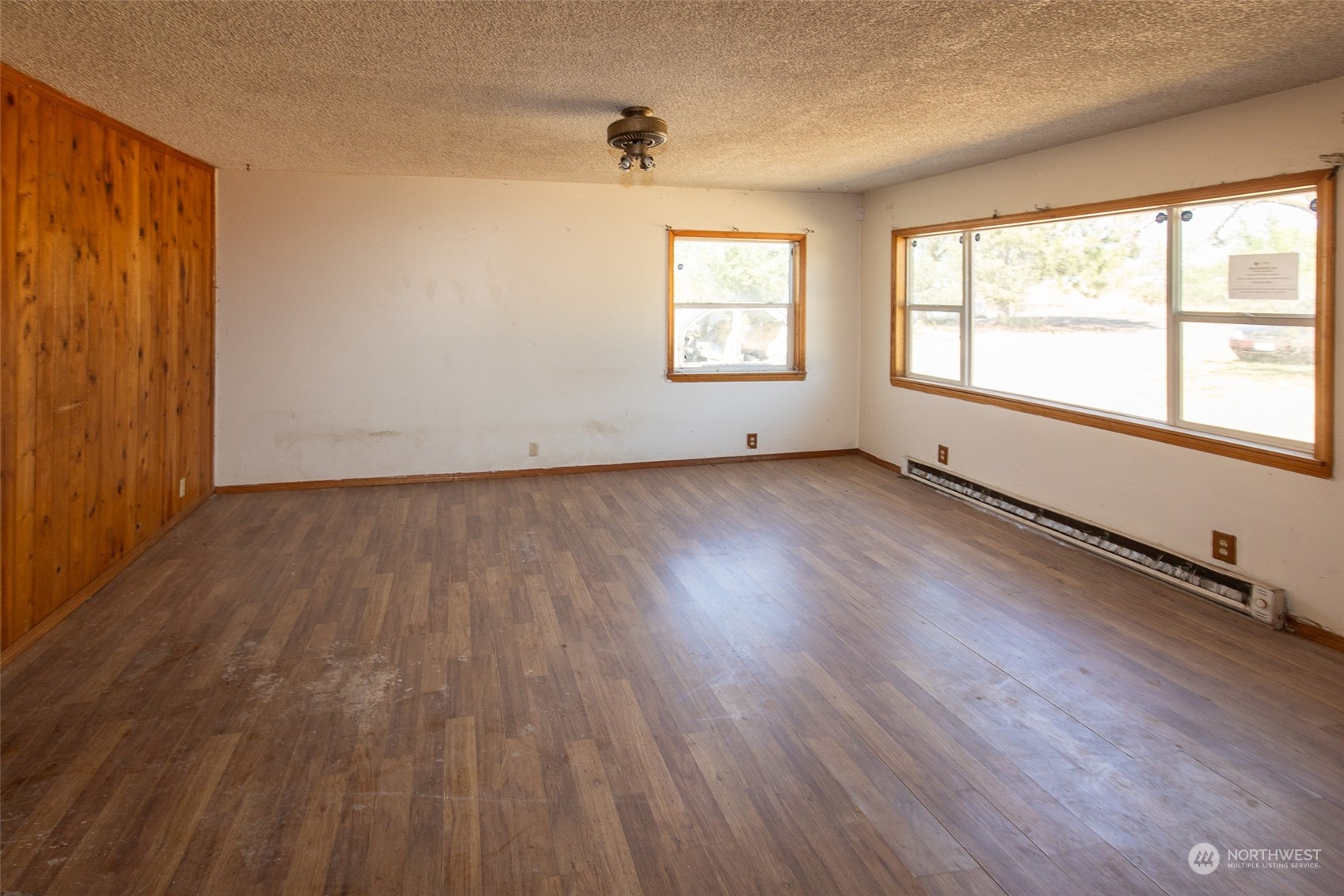 4838 Rd L.9 Northeast Moses Lake, WA 98837 - Photo 9 of 20 an empty room with wooden floor and windows