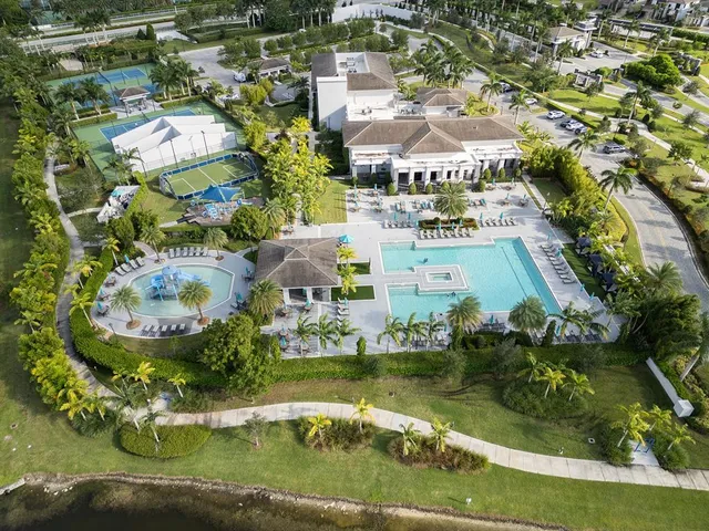 a spacious bathroom with double vanity and a mirror