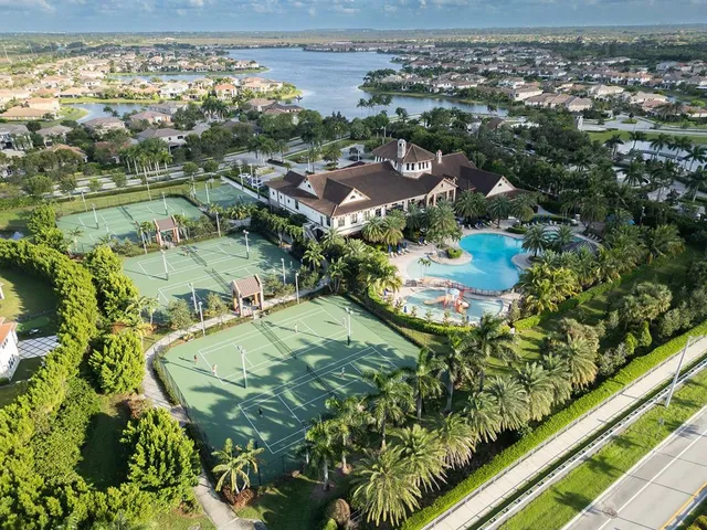 a view of a swimming pool with lounge chairs
