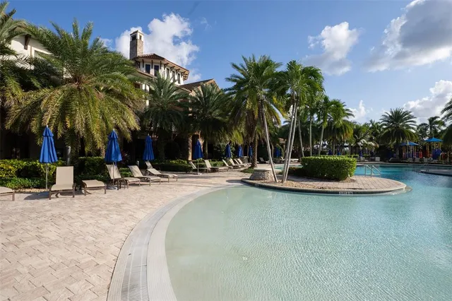 swimming pool view with a outdoor seating