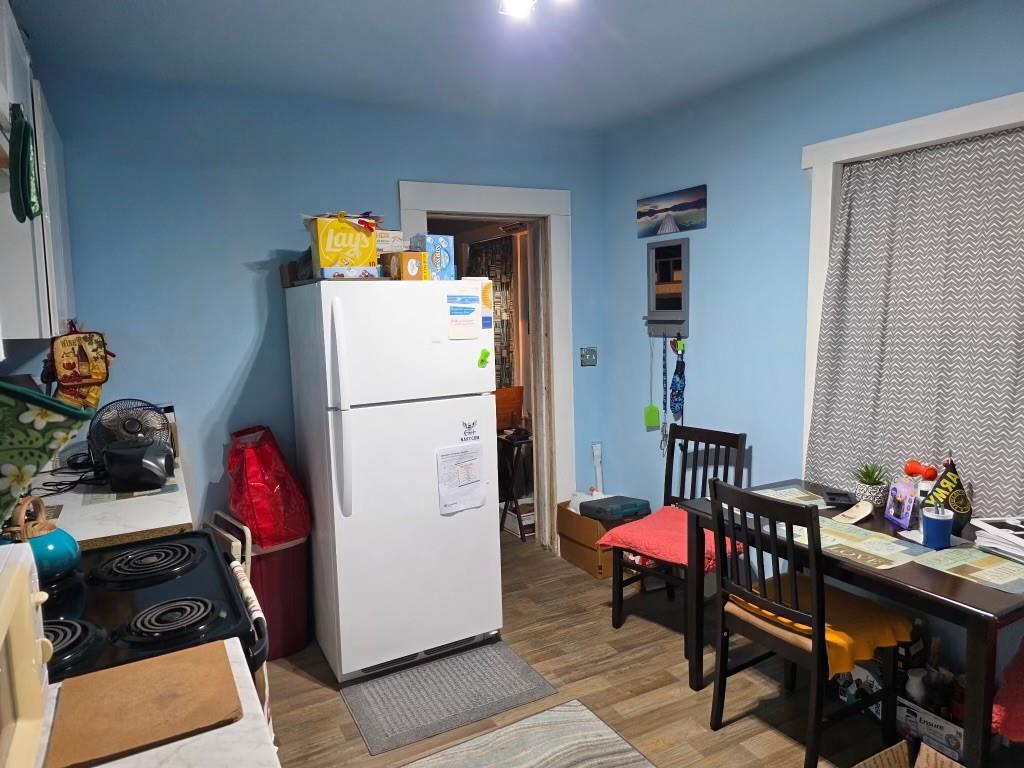 3542 Wericoba Drive Macon, GA 31206 - Photo 15 of 21 a kitchen with a refrigerator and a dining table