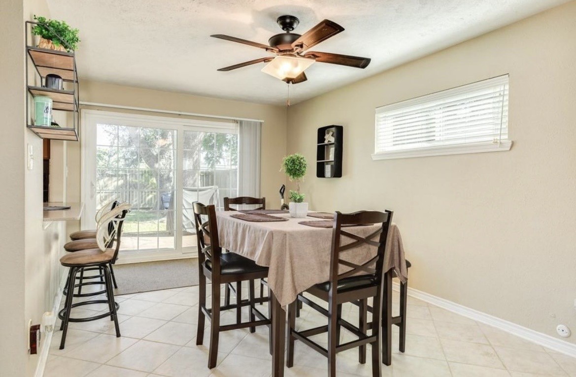 820 Perry Street Angleton, TX 77515 - Photo 15 of 26 a dining room with furniture and window