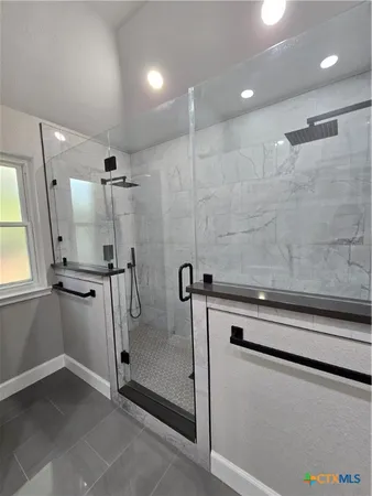 a view of a storage & utility room with a sink