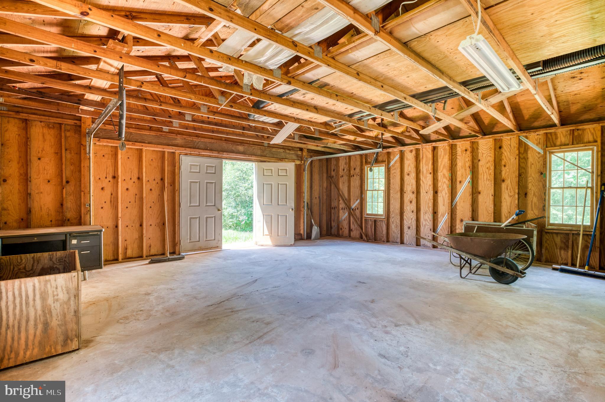 803 Weaver Hollow Road Banco, VA 22711 - Photo 35 of 67 a view of an empty room with wooden floor and furniture