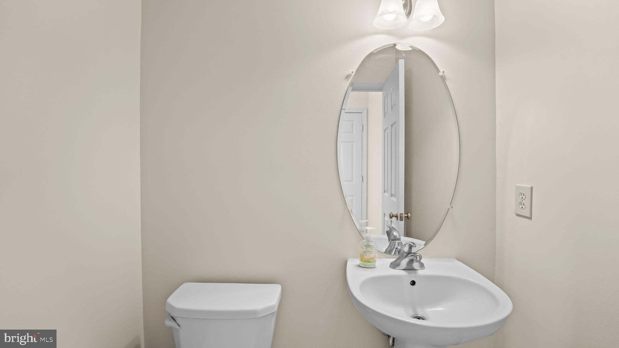 435 Buchanan Road Perkasie, PA 18944 - Photo 12 of 32 a bathroom with a toilet a sink and mirror