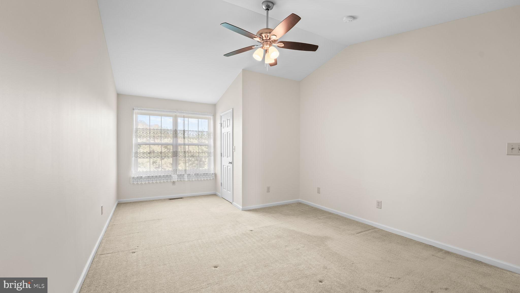 435 Buchanan Road Perkasie, PA 18944 - Photo 14 of 32 an empty room with an empty space and a ceiling fan