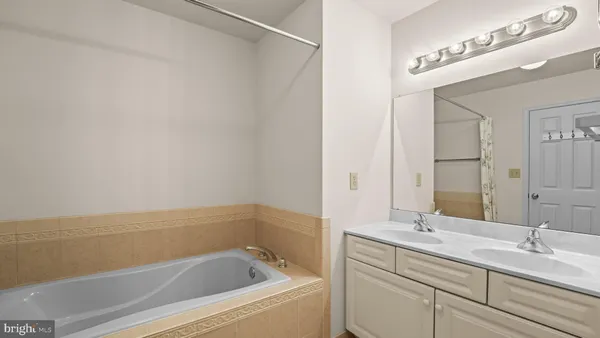 a bathroom with a bathtub and a sink