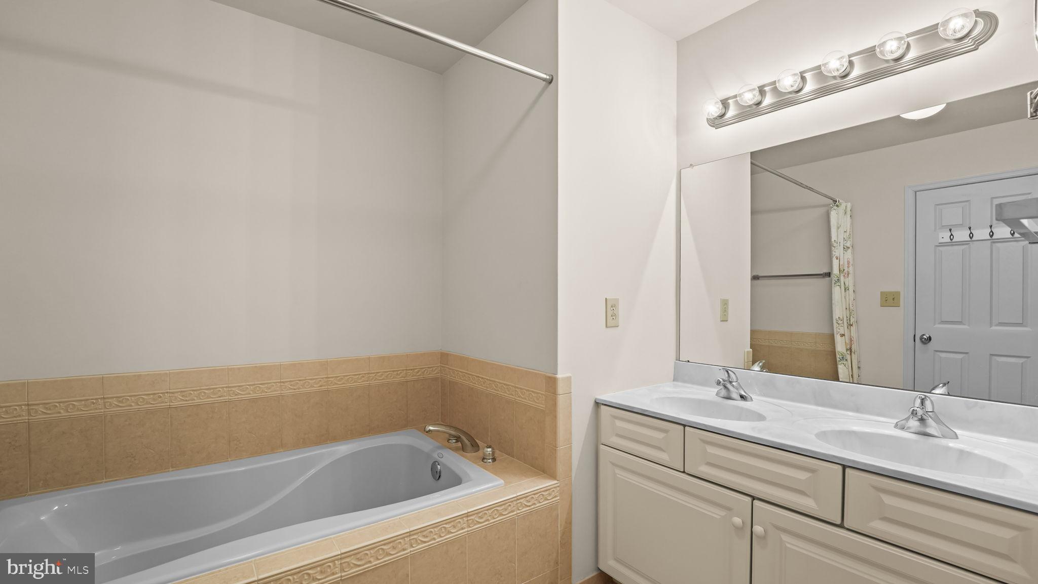 435 Buchanan Road Perkasie, PA 18944 - Photo 16 of 32 a bathroom with a bathtub and a sink