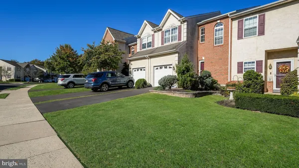 a view of a house with a back yard