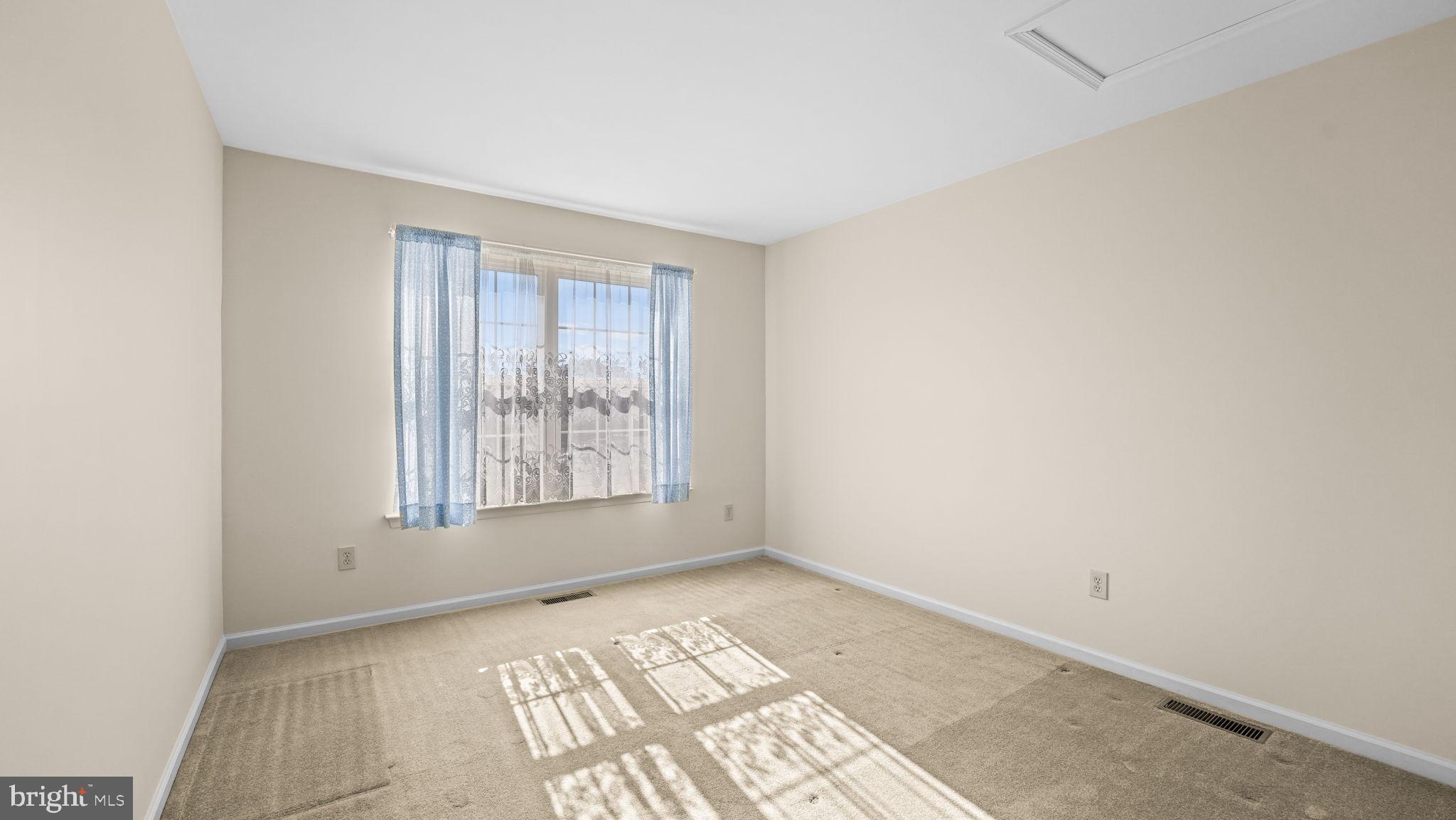 435 Buchanan Road Perkasie, PA 18944 - Photo 21 of 32 a view of an empty room and window