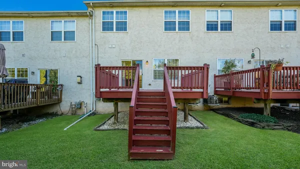 a view of a deck with a yard