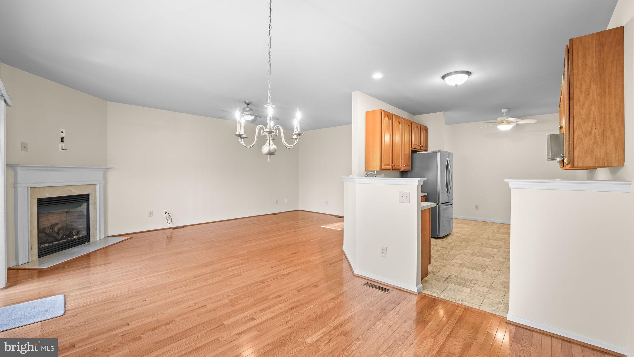 435 Buchanan Road Perkasie, PA 18944 - Photo 8 of 32 a view of a kitchen with a sink and a fireplace wooden floor cabinets