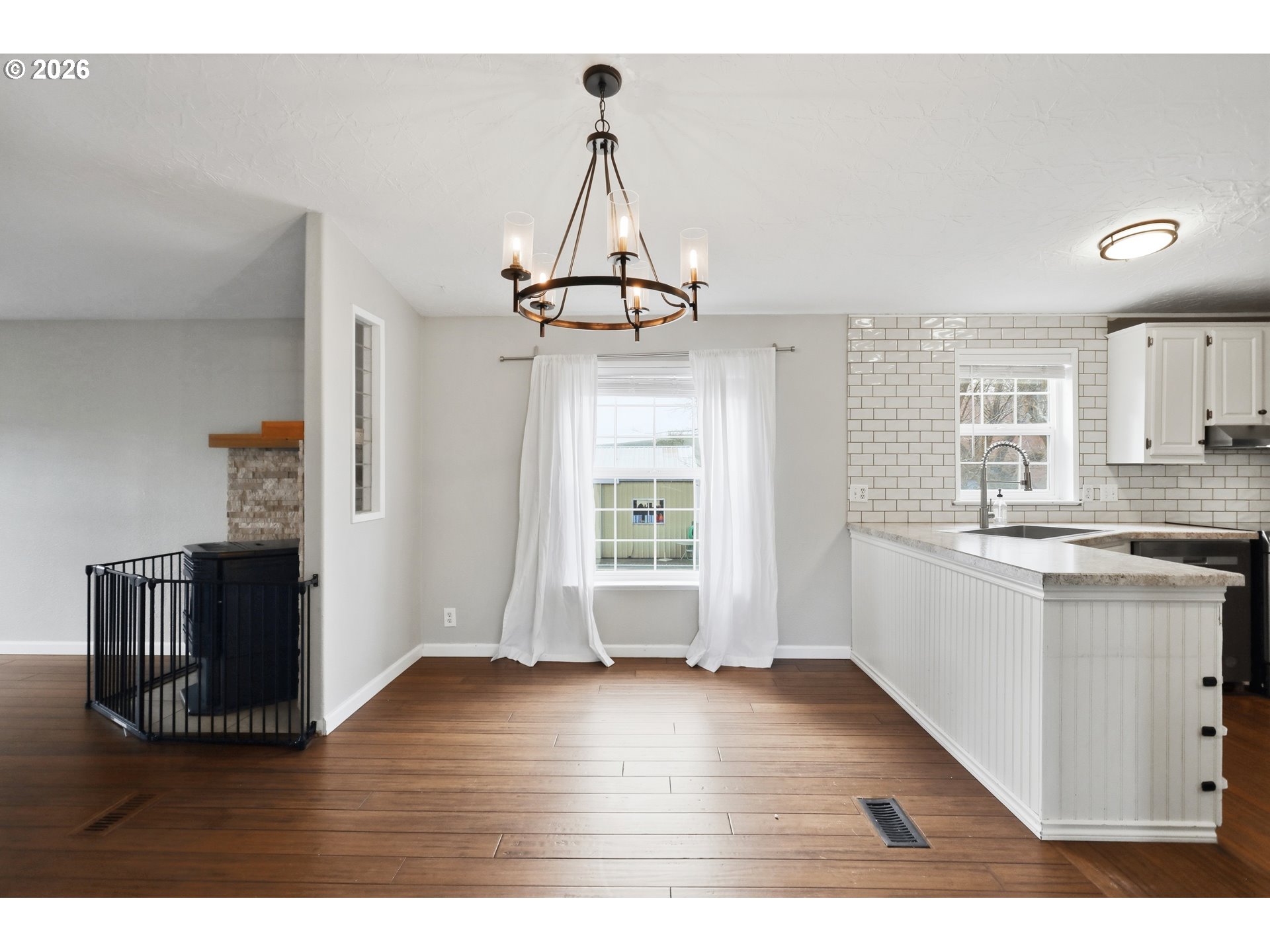 501 Northwest 3rd Street Dufur, OR 97021 - Photo 11 of 44 a view of a kitchen with wooden floor and a window