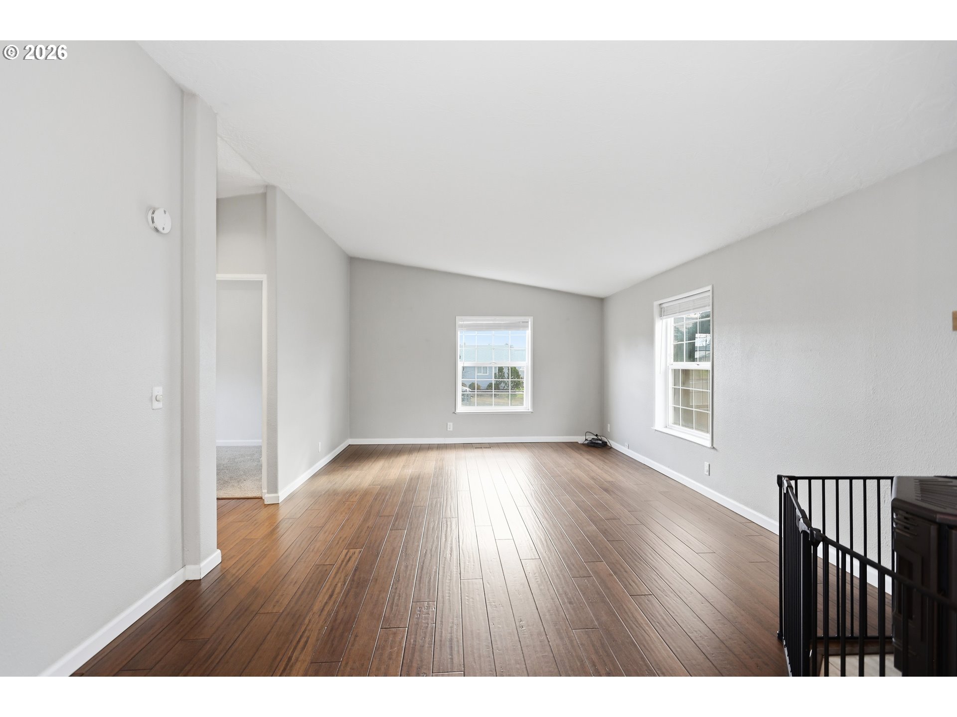 501 Northwest 3rd Street Dufur, OR 97021 - Photo 27 of 44 a view of an empty room with wooden floor and a window