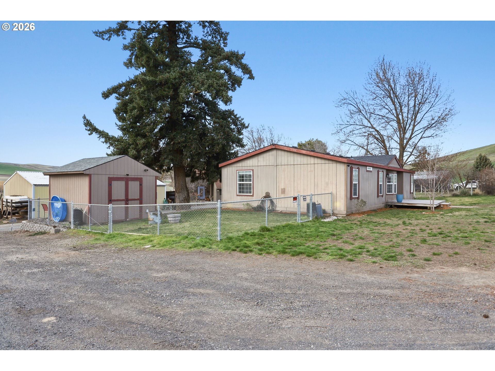 501 Northwest 3rd Street Dufur, OR 97021 - Photo 3 of 44 a view of a yard in front of a house