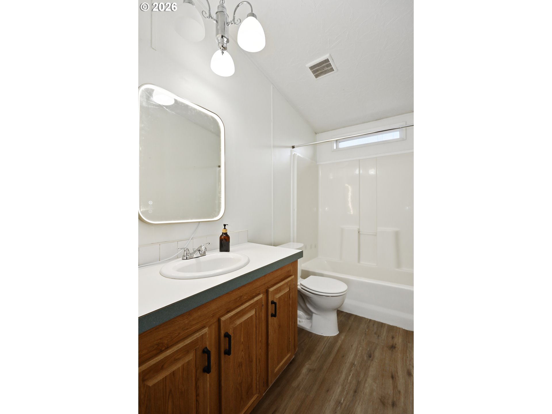 501 Northwest 3rd Street Dufur, OR 97021 - Photo 34 of 44 a bathroom with a sink a toilet and a mirror