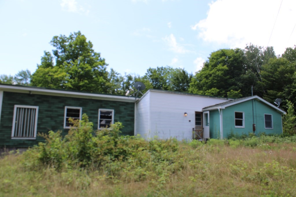15 Stone Hill Road Rowe, MA 01367 - Photo 1 of 23 a view of house with backyard and garden